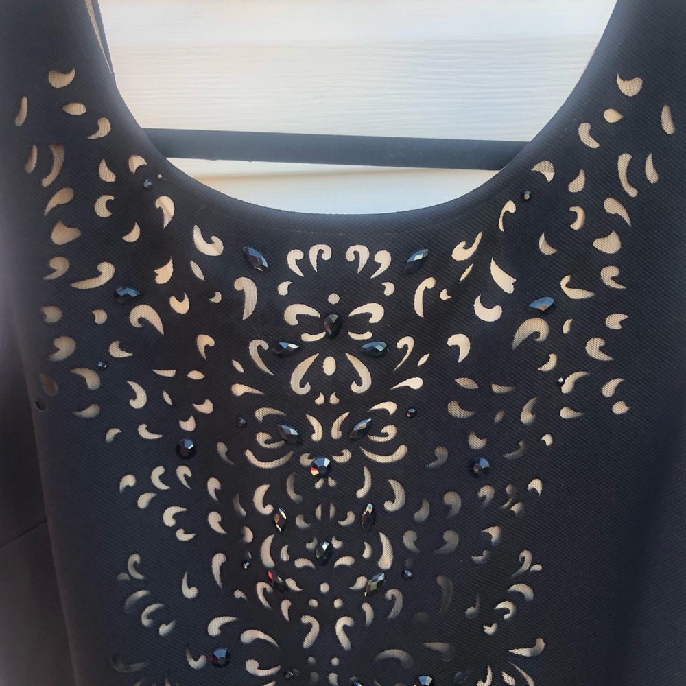 Brand new beautiful cut out top.